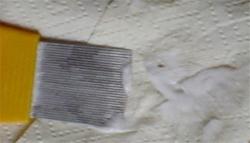 Nit comb wiped on paper towel