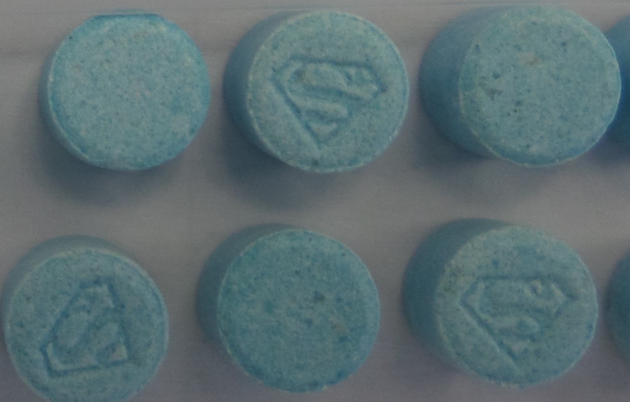Light blue tablets with a superman symbol etched.