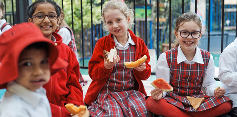 Kids eating fruits