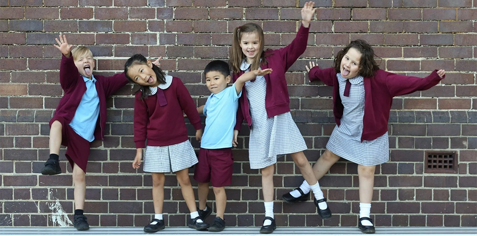 Five happy school kids being silly for the camera 