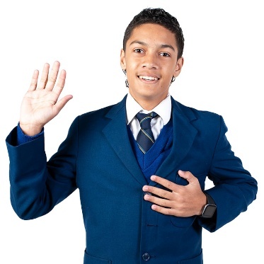A student in school uniform raising their hand and pointing to themself.