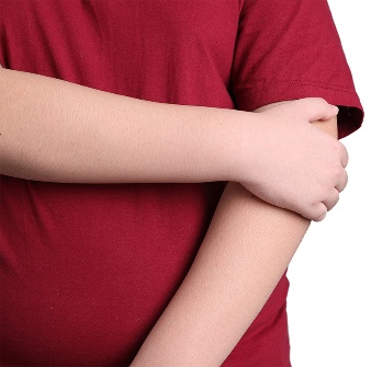 A person holding their elbow with their other arm.