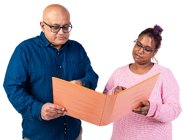 2 people reading a document together.