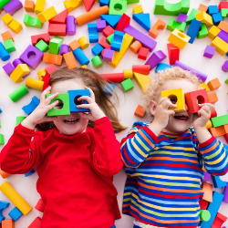 Children playing with coloured blocks