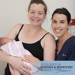 Photo of mother holding a newborn next to a nurse