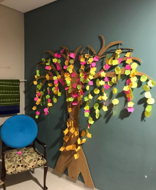 Quiet Room, a space with a chair and a tree decoration on the wall