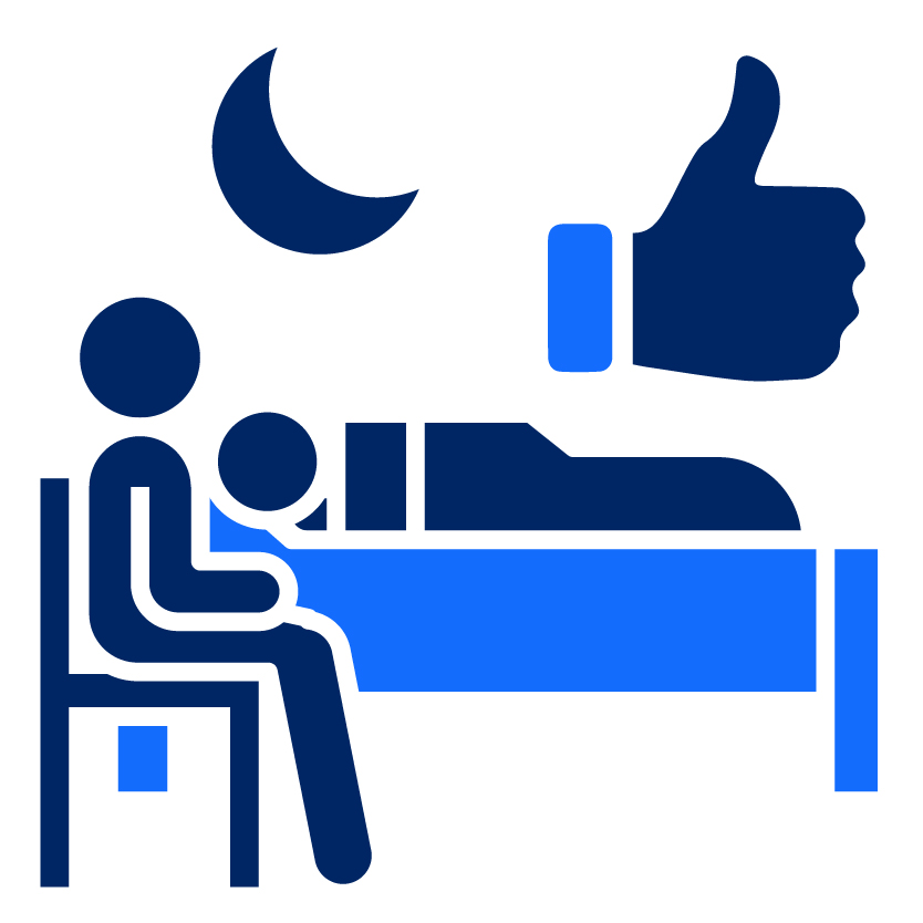 A person seated next to a another person sleeping in a bed and a thumbs up icon above them.
