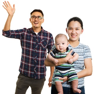 A family of 3. A person raising one of their hand and another person carrying a baby.