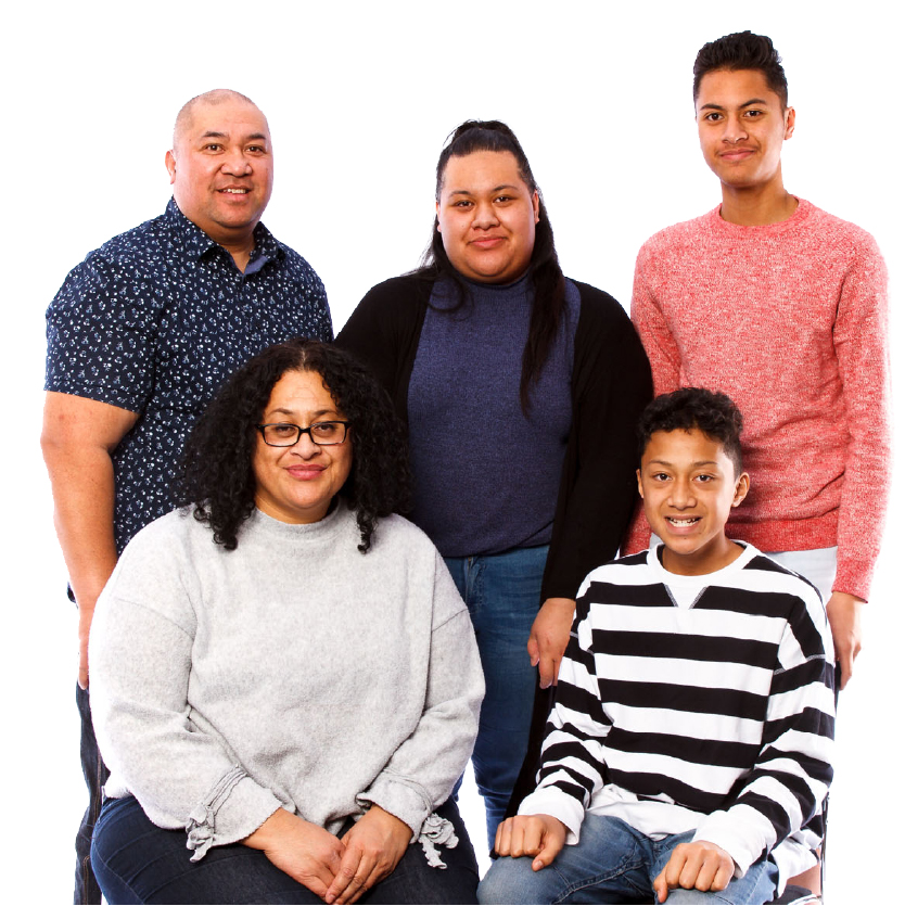A family of 5 smiling.