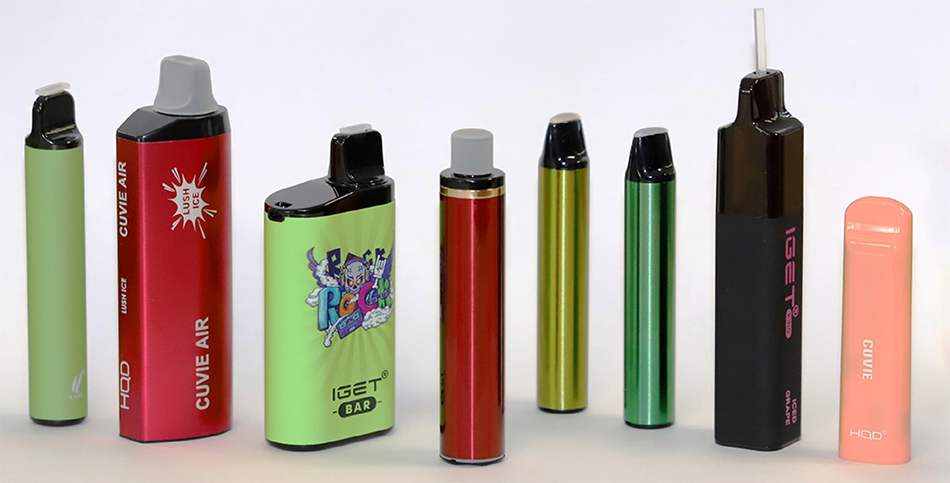 Different shapes of vapes. Some are cylindrical and thin. Some are shorter and wider with flat sides.