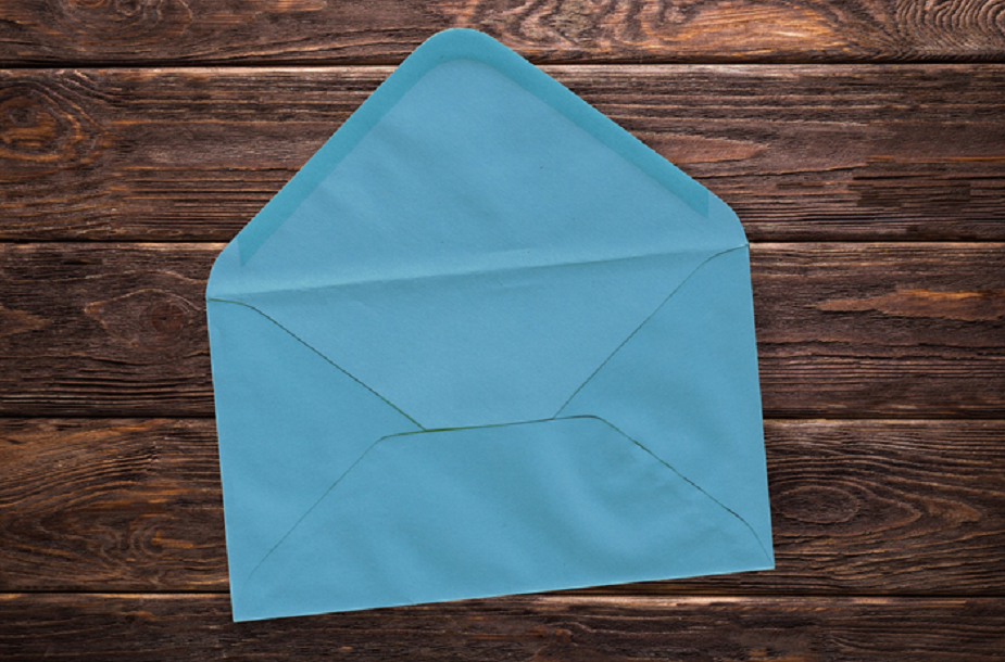 A photo of an envelope such as might be used to post a postcard designed by an inmate