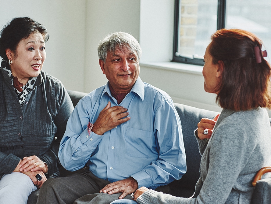 An interpreter translating for 2 people.