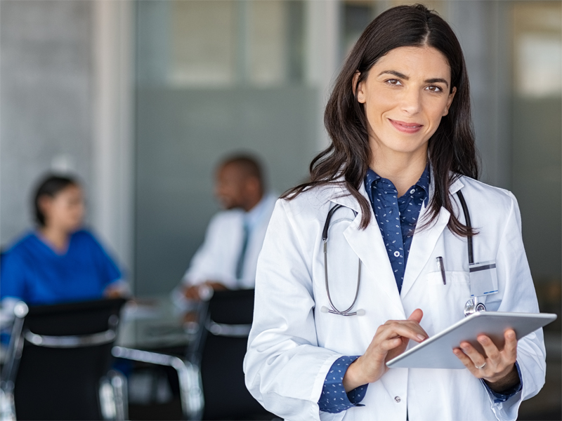 A doctor using a digital tablet.