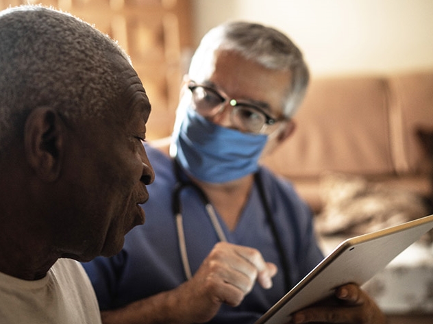 A doctor performing an assessment of a patient.