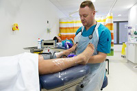 A pediatrist caring for a patient's feet