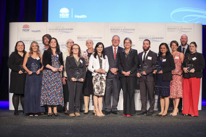 The Hon. Brad Hazzard, Minister for Health and Elizabeth Koff, Secretary NSW Health with winners of the 2019 Excellence in Nursing and Midwifery Awards